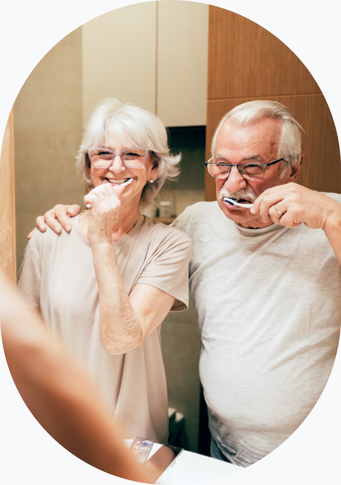 Older couple brushing their teeth together in Westerville OH