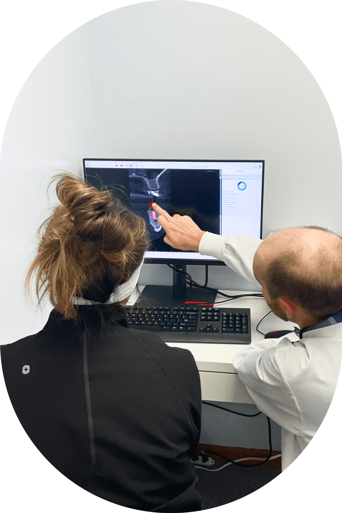 Woman looks at a dental xray with the dentist in Westerville OH