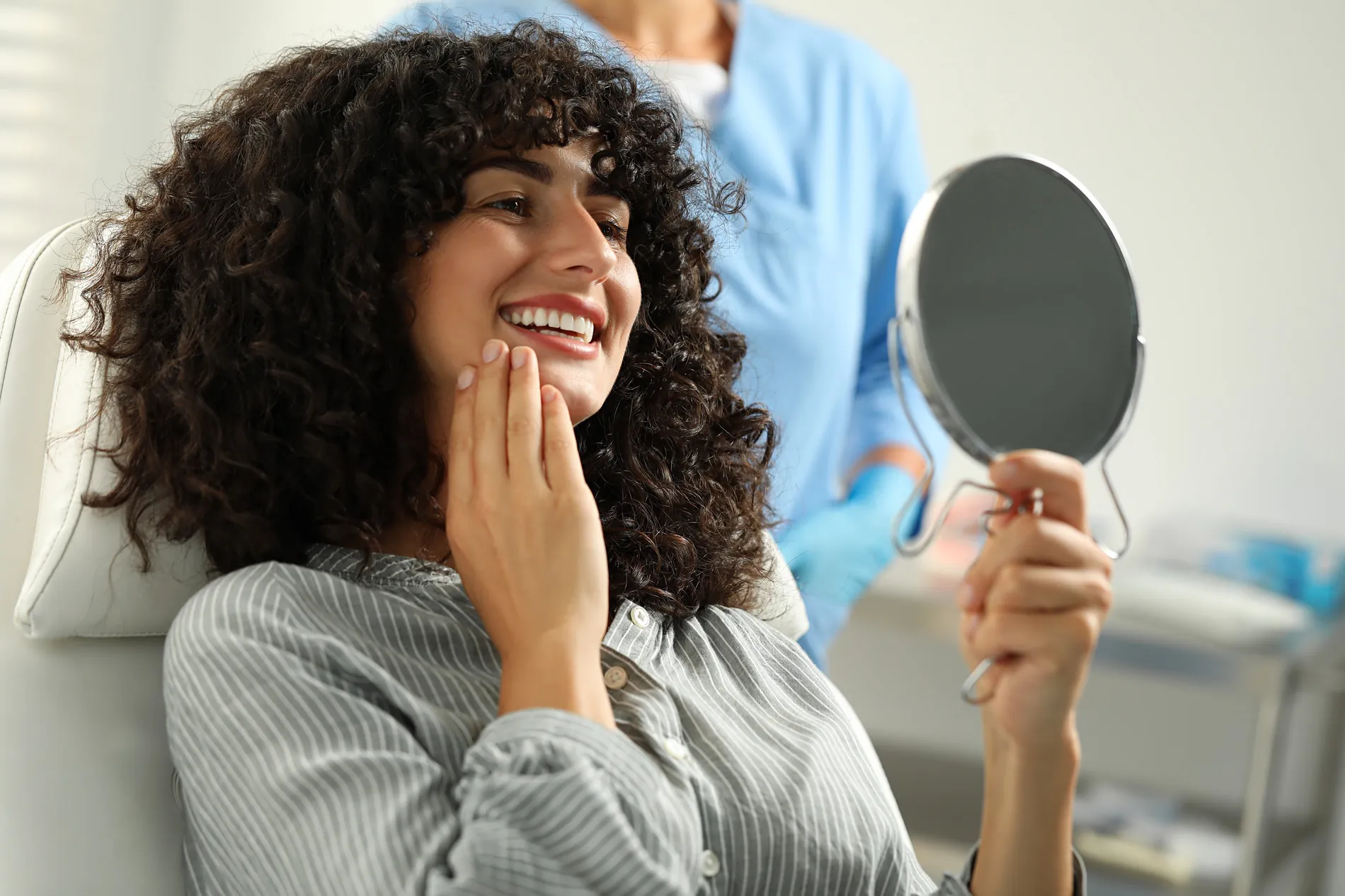 Woman happy after overcoming her dental anxiety with compassionate care from Dr. Stefan in Westerville OH