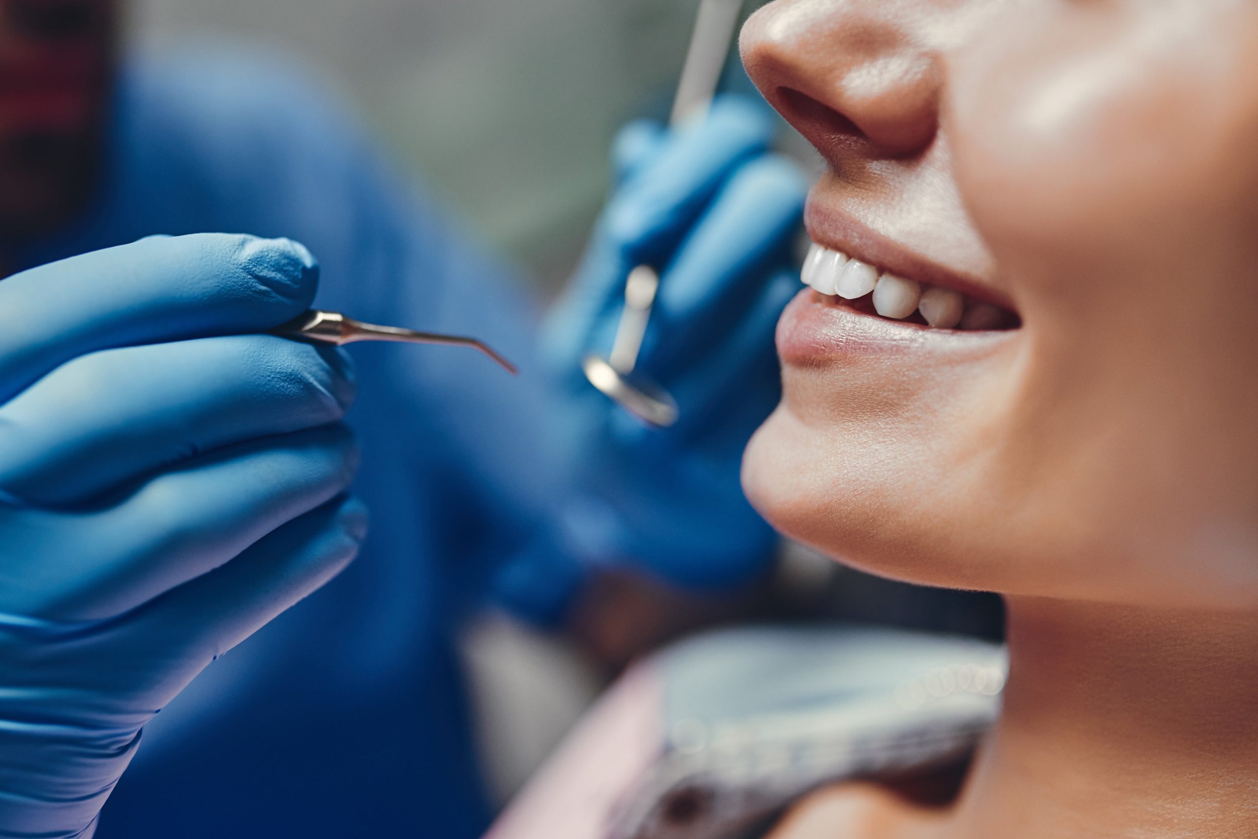 AdobeStock_246187853-min Woman avoiding dental issues at a wellness exam in Westerville, OH